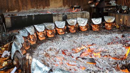 Fish cooking over an open fire in Baghdad during a lively culinary event