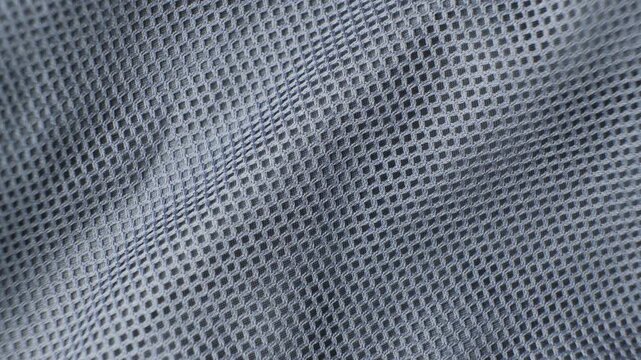 Synthetic polyester fabric macro top view, gray fabric background