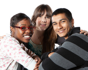 Teenage Students: Best Friends. A relaxed portrait of a small group of late teenage school friends huddled together for a chat. From a series of related images.
