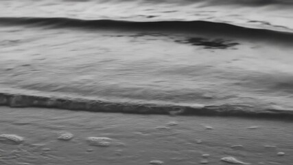 Gray monochrome waves crashing on shore - Powered by Adobe