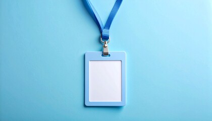 Blank plastic ID card holder with blue neck strap. Employee name tag mockup on a blue background with copy space.