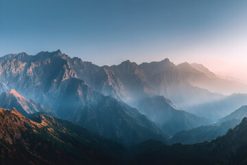 Majestic Mountain Range During Golden Hour Showcasing Vibrant Fall Colors and Ethereal Mist