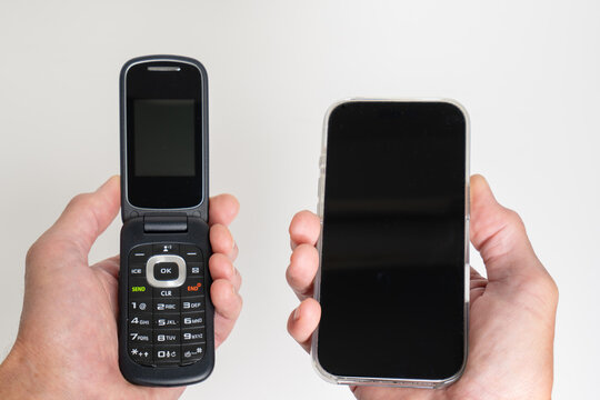 Vintage Retro flip phone versus modern smartphones