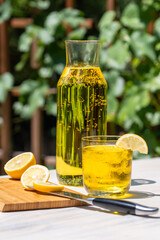 Yellow-themed refreshing ice-cold summer cocktail with lemons