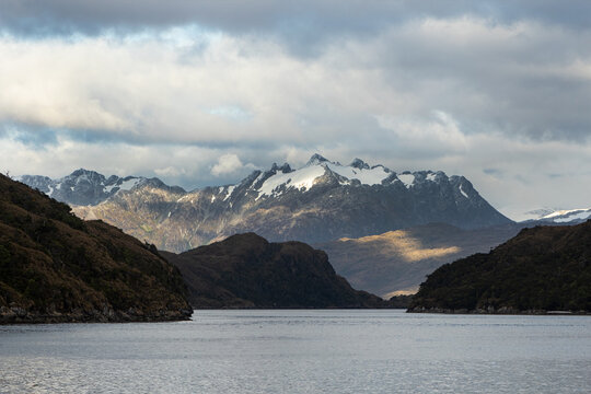 snowy mountain touching the calm waters