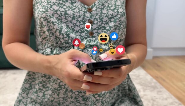 Woman using smart phone with feedback icons of Social Media.Digital marketing, social media, like, media, social network and scrolling concept.Feedback or interactive with friends on chat or emoticon