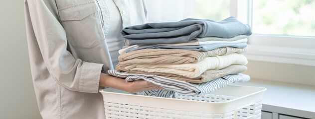 Housewife folding laundry clothes prepare before put in closet