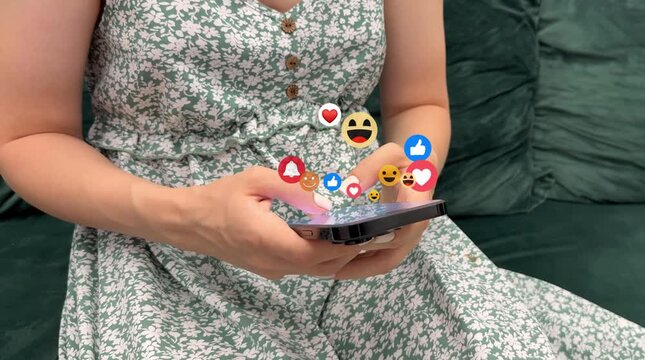 Digital marketing, social media, like, media, social network and scrolling concept.Feedback or interactive with friends on chat or emoticon.Woman using smart phone with feedback icons of Social Media.