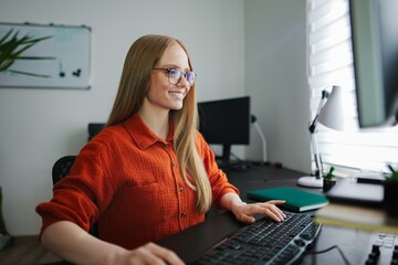 Engaging in creative work at a cozy home office setting