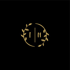 IN feminine and elegant wedding monogram initial logo with circle floral gold