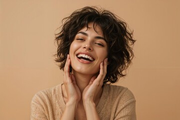 Happy female with natural curly hairstyle showing genuine laughter, positive emotions and joy concept, authentic lifestyle photography for wellness
