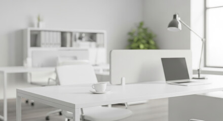 Modern bright office interior with a laptop on a white desk. Blurred background for design.