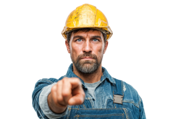 A rugged construction worker in a hard hat and denim overalls, pointing directly at the viewer with a serious and intense expression