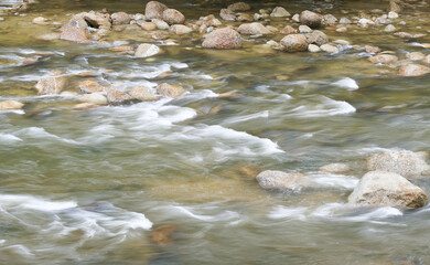Artistic riffles of the clear stream in Khao Luang foothills of Khiri Wong village, the best ozone area in Thailand, Nakhon Si Thammarat Province