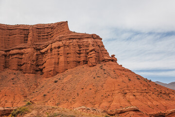 Majestic red rock formations in Charyn Canyon, Kazakhstan.  A stunning natural landscape featuring...