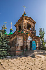 Ancient wooden orthodox church with turquoise domes in the Altai Krai region of Siberia, Russia. ...