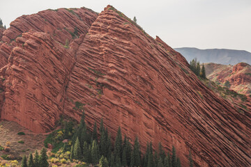 Majestic red rock formations in the Charyn Canyon, Kazakhstan.  Striking layers of sedimentary rock...