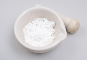 Creatine Powder on light grey background