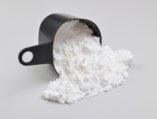Creatine Powder on light grey background