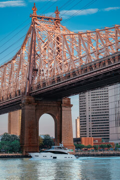 queens  bridge New York skyline boat river 
