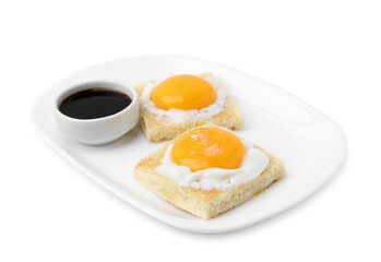 Fototapeta premium Tasty kaya toasts with half-boiled eggs and soy sauce isolated on white. Traditional asian breakfast