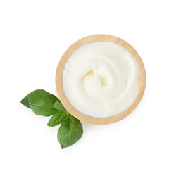 Tasty yoghurt in bowl and basil isolated on white, top view