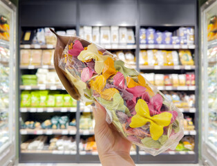 choosing spaghetti in a supermarket	
