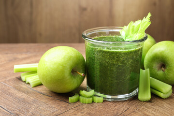 Superfood. Tasty smoothie in glass and ingredients on wooden table, closeup