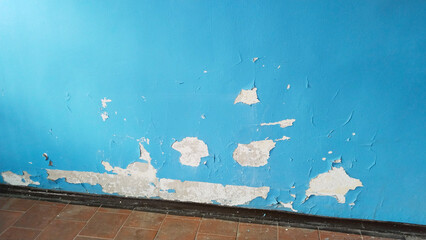 Old home. Cracked blue paint. Dirty floor. Cleaning. Peeling paint background. House repair....