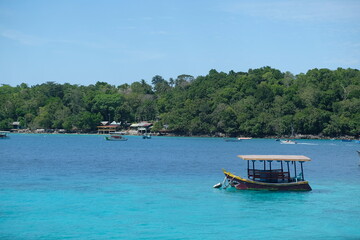 Tranquil Tropical Island Scene with Traditional Boat
