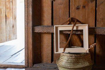 Rustic wooden door frame with woven basket and framed artwork