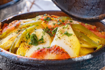 The delicious Moroccan dish tagine is a combination of bright spices and fresh vegetables, cooked in traditional pottery.
