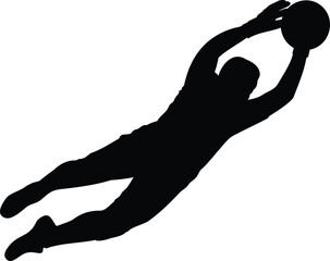 Silhouette of a soccer goalkeeper diving to catch the ball

