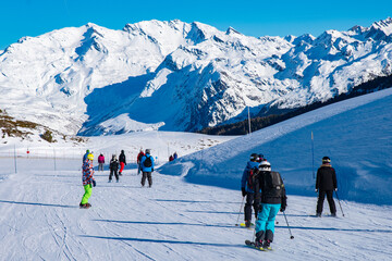 People enjoy ski and snowboard for winter holiday in Alps area, Les Arcs 2000, Savoie, France,...