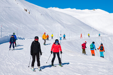 People enjoy ski and snowboard for winter holiday in Alps area, Les Arcs 2000, Savoie, France,...