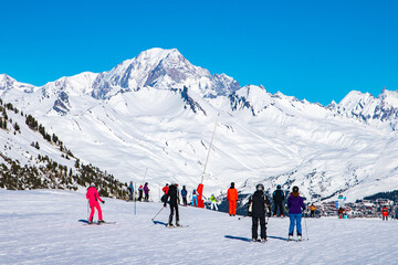 People enjoy ski and snowboard for winter holiday in Alps area, Les Arcs 2000, Savoie, France,...