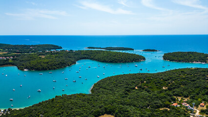 Fototapeta premium Scenic aerial view of Veruda Island and surrounding islets near Pula, Croatia – boats, turquoise sea and lush Adriatic archipelago