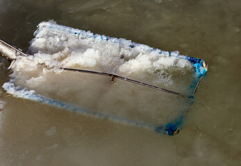 Sea salt production. Fleur de sel - salt flakes. Mount of organic fleur de sel being skimmed from...