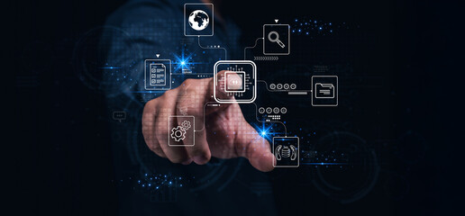 A hand interacts with a digital interface displaying icons representing technology, data, and...