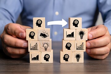 Businessman connecting two stacks of wooden blocks with business growth icons and human head symbols