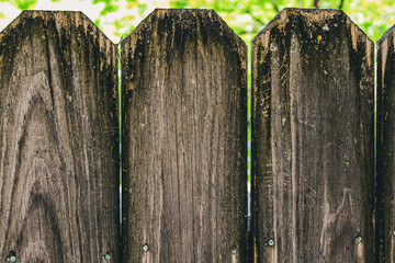 close-up of a wooden picket fence abstract weathered rustic background with copy space. home...