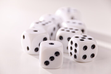 A random arrangement of dice and a puzzle cup, captured after the dice have been cast.
