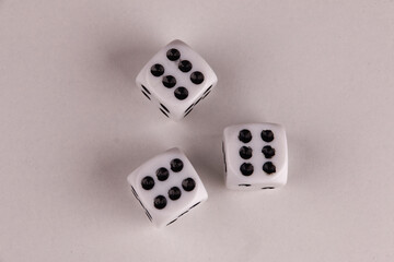 A random arrangement of dice and a puzzle cup, captured after the dice have been cast.