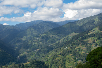 Sun rays falling on Himalayan mountain range, scenic beauty of layers of mountains, Okhrey, sikkim,...