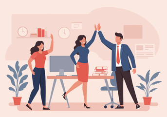 Three colleagues celebrate a success in the office, giving a high five near a desk with computer, books and plants.