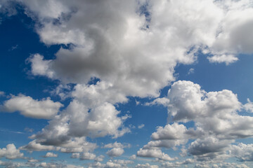 Cloudy weather and blue sky on a bright day, clouds drifting high in the sky, cloudy landscape,...
