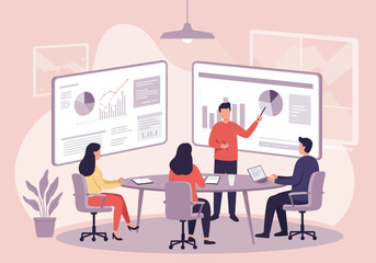 A man presents data using charts to a group of three colleagues in a meeting room, sitting around a table with laptops.