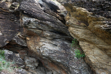 Natural cliff surface of gneiss rock. Gneiss rock texture.      
