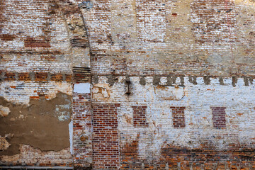 Close up of decaying layers on an old brick building