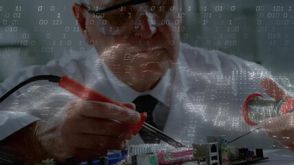 Senior technician feeding solder from spool onto iron soldering motherboard for electronics repair - Powered by Adobe